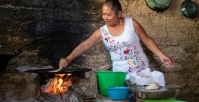 woman in white and pink floral tank top cooking